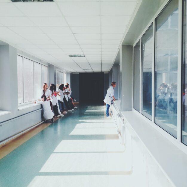people standing in a hospital hallway