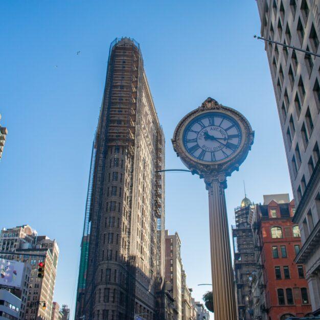 a clock in the middle of a city