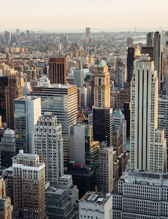 a photo of Manhattan, NY showing many tall city buildings